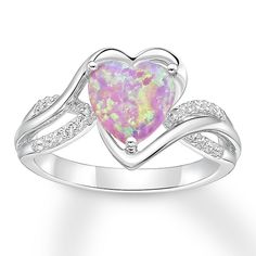 A heart-shaped, lab-created pink opal shimmers in the center of this feminine ring for her. Curves of sterling silver and lab-created white sapphires create the band to complete the look. Pearl Diamond Jewelry, Cross Jewelry Necklace, Fan Jewelry, Jewelry Advice, Heart Shaped Rings, Opal Ring, Pink Opal, Pretty Jewellery, Opal Jewelry