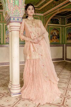 Peach kurta with all over marori floral embroidery and gota embellishments. Comes with can can attached lehenga and dupatta.
Components: 3
Pattern: Embroidered
Type Of Work: Thread, Gota, Marori
Neckline: Notched
Sleeve Type: Three quarter
Fabric: Lehenga and Kurta: Pure Spun Silk, Dupatta: Pure Organza
Color: Peach
Other Details: 
Attached lining
Approx. Product Weight: 2.50kg
Model Height: 5 ft 7 inches, wearing size S
Note: Only selling the product mentioned in description
Occasion: Sangeet,R Peach Georgette Sets With Zari Work, Embroidered Sharara For Reception, Peach Dupatta Set For Reception, Peach Semi-stitched Floor-length Sharara, Peach Color Sets With Dupatta For Reception, Floor-length Peach Sharara, Peach Wedding Sets With Resham Embroidery, Traditional Peach Palazzo Set With Zari Work, Unstitched Peach Lehenga For Festive Occasions