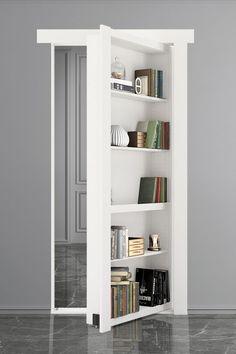 an open book shelf with books on it in a room that has gray walls and marble flooring