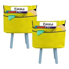 two yellow bins with name labels on them sitting side by side in front of each other