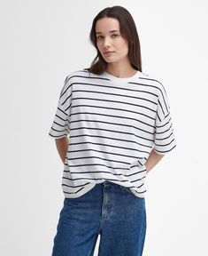 The Barbour Marnie Striped T-Shirt is a must-have style for laid-back days. This super-soft, yarn-dyed cotton t-shirt features short sleeves and dropped shoulders for a casual look, while the relaxed fit and woven logo patch the reverse ensures its made for everyday wear. Summer T-shirt With Shirttail Hem For Everyday, Spring T-shirt For Casual Gatherings With Shirttail Hem, Relaxed Fit T-shirt With Shirttail Hem For Day Out, Spring Casual T-shirt With Shirttail Hem, Summer Shirttail Hem T-shirt For Everyday, Oversized T-shirt For Summer Casual Gatherings, Trendy Striped T-shirt With Relaxed Fit, Relaxed T-shirt For Casual Summer Gatherings, Casual Cotton Short Sleeve Top