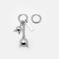 TRI-CHARM DEMON BALL EARRINGS | RARE-ROMANCE Trendy Silver Earrings With Charms, Edgy Single Small Hoop Earring, Silver Hoop Jewelry For Streetwear, Metal Hoop Earrings For Streetwear, Edgy Hoop Jewelry For Streetwear, Charm Small Hoop Metal Earrings, Single Metal Earring For Streetwear, Streetwear Dangle Pierced Earrings, Pierced Hoop Jewelry For Streetwear