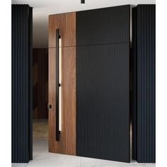 an open wooden door with black slats on the outside and wood paneling on the inside