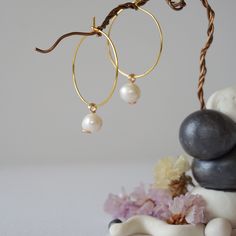 Connect to your inner Goddess with the energies of these uniquely crafted pearl earrings. Our pearl hoop earrings are known for: HANDMADE ORIGINAL DESIGN - We customize each pearl earring to the unique shape of its stone. This process makes your hoop earrings truly one of a kind. AUTHENTIC CRYSTALS & ALLERGY FREE MATERIALS - Your pearls are authentic, raw and natural. Our artists sort through hundreds of pearls to find yours. We only use nickel-free, lead-free and allergy-free metals for your ea Pearl Hoop Earrings, Pearl Charms, Original Designs, Pearl Earrings, Gold Plate, Hoop Earrings, Plating, Stone, Crystals