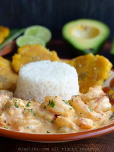 a plate with rice, shrimp and avocado next to some other food items