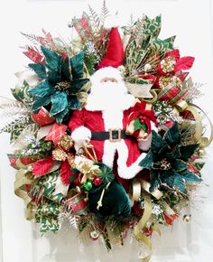 a christmas wreath with santa claus on it