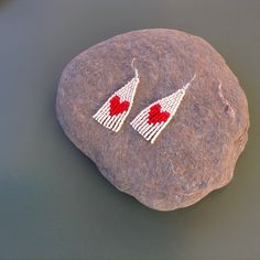 Small Red Heart Earrings OWN ORIGINAL PATTERN DESIGN! Dimensions: Width- 0.8 inches /2.1cm Length (incl. ear wires)- 2.4 inches /6 cm These adorable earrings are a fun and lovely accessory, perfect for a gift or just for no reason! They are made from OUR ORIGINAL pattern, made from high quality glass beads, very lightweight. *Please note that real colors may slightly differ from their appearance on your display! Ready to Ship! Made with love and will be shipped with care! All rights reserved. © Bohemian Drop Heart Earrings For Gift, Bohemian Style Heart Drop Earrings For Gift, Bohemian Beaded Earrings With Heart Beads For Gift, Bohemian Heart-shaped Earrings With Dangling Beads, Heart Beads Dangle Earrings For Gift, Handmade Adjustable Drop Heart Earrings, Handmade Dangle Heart Earrings For Gift, Gift Heart Beads Drop Earrings, Gift Beaded Dangle Earrings With Matching Set