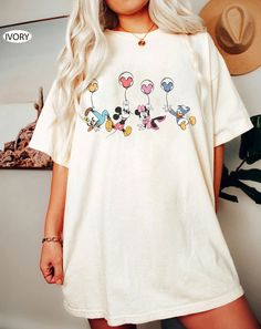 Casual Crew Neck T-shirt With Cartoon Print, White Cartoon Print T-shirt For Spring, Casual Crew Neck T-shirt With Character Print, Summer Crew Neck Shirt With Character Print, Cotton Short Sleeve T-shirt With Cartoon Print, Summer Shirt With Relaxed Fit And Character Print, Summer Relaxed Fit Shirt With Character Print, Casual Relaxed Fit Shirt With Cartoon Print, Casual Multicolor Character Print Shirt