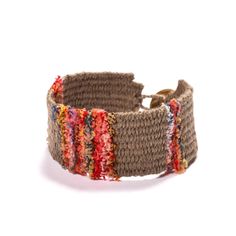 a brown bracelet with multicolored stripes on it