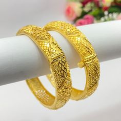 22k Gold Plated Openable Bangles/Kangan/kare/Bridal Indian Jewelry Wedding Jewellery It is a perfect match with formal attire on special occasions or with casual wearing Care instructions Keep Jewellery away from direct heat, water, perfumes, deodorants and other strong chemicals as they may react with the metal or plating. The plating composition of Jewellery is as such that  perspiration (sweat) will not damage it. Wipe Jewellery gently with chamois cloth or leather swatch after every use. Wiping the jewellery with a soft cloth after removing the jewellery would add to its life. Avoid water  exposure for all jewelry  Thank You For Visiting Elegant Bangle For Wedding And Diwali, Elegant Wedding Bangle For Diwali, Wedding Bangle Openable, Marriage Bangle With Intricate Design, Bollywood Style Bridal Sets With Intricate Design, Bollywood Bridal Sets With Intricate Design For Wedding, Elegant Bridal Sets For Marriage During Diwali, Gold Traditional Wear For Eid Wedding, Yellow Gold Bracelets For Wedding And Festive Season