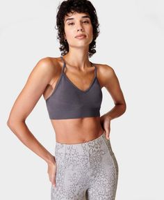 A light support sports bra for the yoga mat and beyond. New-and-improved modal Lenzing™ yarn is super smooth and soft. Strappy racerback and supportive underband. Inner cup pads are removable. Centre front length: 11.5cm / 4.5”. Model wears size S and is 178cm/5'10" tall. Style Code: SB9432Colour: Urban Grey Yoga Bra With Built-in Padding And Medium Support, Micro-elastic Sports Bra With Built-in Bra For Yoga, Compressive Seamless Sports Bra For Yoga, Micro-elastic Seamless Sports Bra With Light Support, V-neck Sports Bra With Light Support And Stretch, Lily White, Yoga Bra, Women's Sports, Sweaty Betty