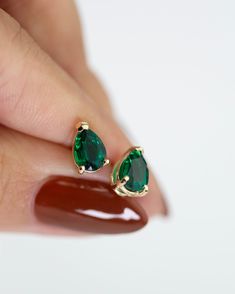 Pear shape Emerald Studs in 14k Gold Prettiest green. Dress up or down with thisstuds. •Sold as a pair or as a single stud.•14k solid gold•Emerald measures 7x5mm 0.73-0.75 carat •This lab-created emerald has a chemical make-up identical to the finest emeralds. Emerald Studs Indian, Pear Shaped Emerald Earrings, Small Emerald Earrings, Emerald Pear-shaped Fine Jewelry Earrings, Pear-shaped Emerald Green Earrings, 14k Gold Jewelry Set With Green Matching Earrings, 14k Gold Jewelry With Green Prong Setting, Green 14k Gold Jewelry With Prong Setting, Green 14k Gold Pear-shaped Jewelry