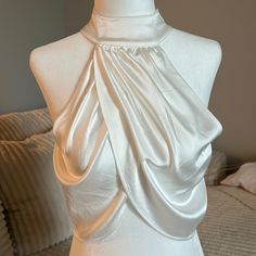 a mannequin with a white dress on it's back and neckline