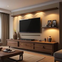 a living room with a large flat screen tv mounted on the wall above it's entertainment center