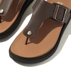 Our next-generation sandals bring a refined modern edge (and our original ultra-cushioning tech) to the classic T-bar leather toe-post sandal. Boasting a directional chunky sole and simple soft-leather strap, with a logo'd stud at the front. A square brushed-metal buckle gives a customized fit. While minimal stitching, leather welt sole detail, and leather linings add to the elevated feel. On a light clean-look version of our triple-density Microwobbleboard™ midsole, biomechanically engineered f Classic T-strap Sandals With Textured Footbed, Modern Brown Footbed Sandals With Round Toe, Modern T-strap Sandals With Cushioned Footbed, Modern Leather Flip Flops With Textured Footbed, Leather Toe Post Footbed Sandals, Leather T-strap Toe Post Sandals With Arch Support, Classic T-strap Sandals With Cushioned Footbed, Leather Toe Post Footbed Sandals With Textured Footbed, Leather T-strap Sandals With Arch Support