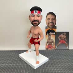 a custom bobble head is shown with an image of a man in red trunks