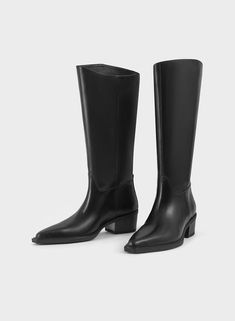 KELSEY Tall Black Leather Boots by Swedish brand Vagabond Shoemakers. Black leather tall boots with a Western-inspired look. These boots are crafted in black leather with a pointed toe shape, pull-on shaft with decorative seams. Sleek block heel measures just under 2 inches. Black knee-high western boots. The perfect pair of minimalistic black leather tall boots to wear dressy or casually. Wear these pull-on tall black boots with jumpsuits, mini skirts, wide leg jeans, a pleated midi skirt or lo Black Leather Tall Boots, Tall Black Leather Boots, Knee High Western Boots, Vagabond Shoemakers, Decorative Seams, Tall Black Boots, Leather Tall Boots, Swedish Brands, Black Boots Tall