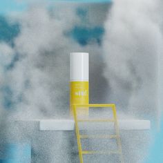 a yellow ladder sitting on top of a blue and white wall next to a cloud filled sky