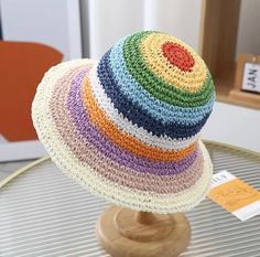 Rainbow Straw Bucket Hat 🌈 Perfect for the Spring/ Summer season, festivals, beach days, lazy garden days and more! The breathable paper/straw material offers protection from UV Rays and comes with an inner adjustable cord. The wired brim also helps to keep the hat in it's desired shape. Size 56-58cm Multicolor Bucket Straw Hat For Spring, Playful Summer Beach Straw Hat, Multicolor Straw Hat For Summer Outdoor, Playful Adjustable Hat For Vacation, Multicolor Sun Hat With Uv Protection For Outdoor, Multicolor Uv Protection Sun Hat For Outdoor, Adjustable Multicolor Straw Hat For Spring, Playful Adjustable Wide Brim Straw Hat, Playful Brimmed Straw Hat For Summer