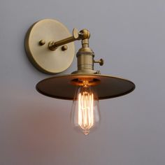 a light that is on the wall with a bulb attached to it's side