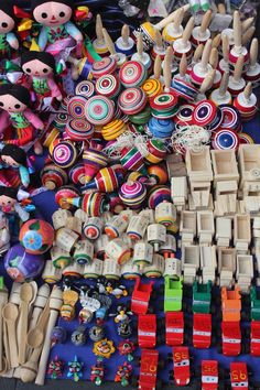 many different wooden toys are on display for sale