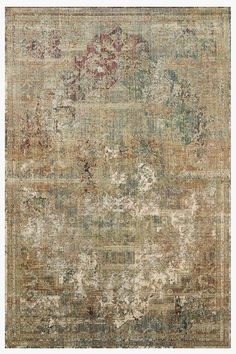 an antique rug with faded colors and floral designs on the bottom, in neutral tones