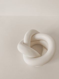 a white sculpture sitting on top of a table