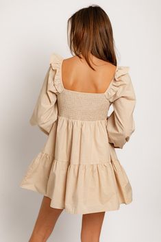 Effortlessly turn heads with the Georgia Dress! This flowy beige mini dress is designed with a classic babydoll silhouette and romantic ruffle long sleeves, creating a look that is feminine and timeless. Make a statement in this stylish dress and you'll be sure to be trending sis. Model is 5'8 wearing a size small. This item does have stretch. Fabric is 100% cotton. Cream Long Sleeve Mini Dress For Brunch, Cream Mini Dress With Ruffles For Day Out, Beige Puff Sleeve Dress With Ruffle Hem, Beige Dresses With Ruffle Hem And Puff Sleeves, Beige Dress With Ruffle Hem And Puff Sleeves, Beige Dress With Puff Sleeves And Ruffle Hem, Flowy Long Sleeve Ruffle Dress, Beige Ruffle Dress For Brunch, Fall Mini Dress With Ruffles And Puff Sleeves