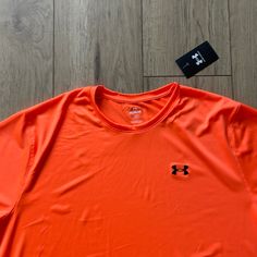 Nwt Under Armour Bright Orange Polyester T-Shirt Great For Hunting New With Tags Men’s Size (Xl Is Just What Is Photographed) 100% Polyester Orange Crew Neck Sports Top, Orange Athleisure Top For Streetwear, Orange Short Sleeve Workout Top, Orange Crew Neck T-shirt With Moisture-wicking, Orange Short Sleeve Moisture-wicking Top, Orange Moisture-wicking Short Sleeve Tops, Under Armour Crew Neck T-shirt For Streetwear, Under Armour Crew Neck Moisture-wicking T-shirt, Under Armour Moisture-wicking Crew Neck T-shirt