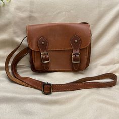 Beautiful Handmade Italian Leather Crossbody Bag Made In Greece : Stunning Hand Crafted Tanned And Rubbed Leather. Zippered Back Pocket With Magnetic Flap Closure On The Bottom Front . Slot Pocket On Front U See Flap And Slot Pocket Inside . Great For Necessities On The Go . Good Condition. Never Used . Please Refer To All Photos For Full Details. Measurements In Photos Tan Crossbody Bag, Tan Brown, Italian Leather, Leather Crossbody Bag, Bag Making, Leather Crossbody, Inside Pocket, The Go, Greece