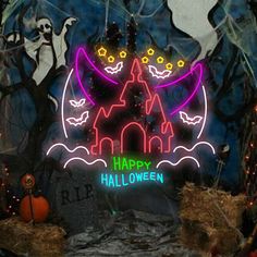 a halloween scene with pumpkins and bats in the foreground is an illuminated castle