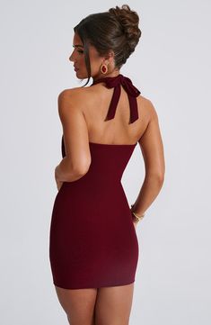 Fallon is the mini on everyone's mind. With a super sculpted, figure-hugging fit, this design is made from our premium double layered mesh with a low plunge neckline and tie to the back of the neck. It's complete with boned cups for added support with a cowl overlay detail. Pair with white thong mule heels and a mini bag. 



Colour: Burgundy.

Double layered mesh fabric.

Fully lined.

Hugs the figure.

Super sculpted fit.

Low plunge halter neckline.

Boning in cups provides extra support and Winter Dance Dresses, Core Clothes, Social Dress, Pink Monochrome, Birthday 21, Jumpsuit Winter, Midi Dress Wedding Guest, Burgundy Mini Dress, Mule Heels