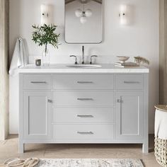 a bathroom with a sink, mirror and rug