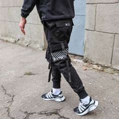 A new word in cargo pants. Convenient, practical and affordable. GENERAL INFORMATION - Sizes: XXS, XS, S, M, L, XL - Fabric: 100% cotton - Slim fit, bottom cuffs - Elastic band and cord for adjustment at the waist. - Straps with fasteners on the pockets - Print on the left pocket Pockets: - main oblique in front - patch pockets in the knee area - overhead at the back SIZE: We use the international dimensional grid to determine the size. But we prefer to sew clothes for each specific customer by Combat Style Cargo Pants With Belt Loops For Streetwear, Techwear Cargo Pants With Functional Pockets, Black Combat Parachute Pants With Functional Pockets, Cyberpunk Cargo Pants With Multiple Pockets For Outdoor, Combat Style Black Cargo Pants With Functional Pockets, Black Combat Cargo Pants With Functional Pockets, Combat Cargo Pants With Functional Pockets In Black, Techwear Cargo Pants With Multiple Pockets For Urban Adventures, Cotton Techwear Cargo Jeans