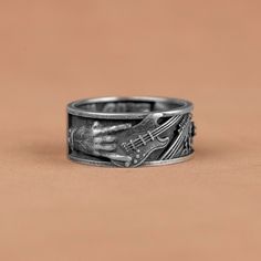 Unique Rockn Roll Tehemed Silver Band Rings, Guitar Engraved Band Ring, Punk Style Men Band Ring, Electric Musical Gift Rings, Birthday Gift   Made of 925 silver and handcrafted by hand, this ring is not only an accessory piece that complements your daily elegance, but also has details that will reflect your character and style. It is also a great gift to give to your loved ones on their special days. At SavisSilver, we always give importance to the satisfaction of our customers, we recommend yo Guitar Ring, Punk Style Men, Silver Band Rings, Musical Gift, Style Punk, Mens Band, Punk Style, Silver Band Ring, Men's Rings