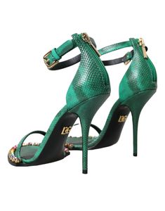 Dolce & Gabbana ankle strap heels sandals with crystal embellishment. Made from high-quality exotic leather, these sandals feature a chic crystal embellishment that will elevate any outfit. Expertly crafted in Italy, they also boast a durable leather sole and a convenient buckle closure to keep your feet secure and comfortable throughout the day. Model: Heeled sandals Color: Green Material: Leather Sole: Leather Buckle closure 100% Exotic Snakeskin Leather Made in Italy Dolce And Gabbana Blue, Crystal Logo, Crystal Sandals, Ankle Strap Sandals Heels, Dolce E Gabbana, Green Material, Heels Sandals, Crystal Embellishment, Ankle Strap Heels