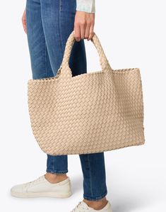 Embrace Naghedi's laid-back elegance with the best-selling St. Barths tote bag. It's expertly woven from neoprene and features a matching pouch that's perfect for toting your everyday essentials.DETAILS: St. Barths Medium Ecru Woven Handbag. Matching zip Beige Pouch Bag With Intrecciato Weave, Pouch Satchel With Braided Handles For Shopping, Beige Woven Leather Satchel Bag, Beige Pouch Shoulder Bag With Intrecciato Weave, Beige Top Handle Bag With Woven Leather, Beige Intrecciato Weave Pouch Shoulder Bag, Beige Intrecciato Weave Shoulder Bag, Cream Woven Leather Bag, Beige Woven Leather Bucket Bag For Shopping