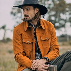 Trucker Jackets revive the spirit of the west, the hard work in the fields, and the outdoors living in the Midwest. We translated all that in our Sequoia Trucker Jacket with western yokes in the front chest and top back. Two flap pockets on the chest, as trucker jackets are meant to be. Made from our iconic harvest gold water-resistant cowhide suede and a lumberjack pattern on the lining. In addition, a contrasting dark brown lamb leather on the back of the neck, cuffs, and pocket flaps match th Fitted Leather Jacket With Pockets For Outdoor, Fall Outdoor Leather Jacket With Pockets, Spring Outdoor Leather Jacket With Pockets, Fall Leather Jacket With Double-needle Sleeve For Outdoor, Fall Outdoor Leather Jacket With Double-needle Sleeve, Classic Winter Shacket For Outdoor, Rugged Outerwear For Hunting, Long Sleeve Hunting Outerwear With Flap Pockets, Rugged Long Sleeve Outerwear For Hunting