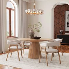 a dining room table with white chairs around it