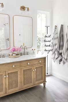 a bathroom with double sinks and two mirrors on the wall next to it is shown