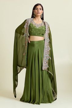 Green asymmetric cape with sequin bead embellished, dabka thread embroidered floral motifs. Paired with padded embroidered blouse and can can attached lehenga. - Aza Fashions Green Hand Embellished Gown For Eid, Hand Embellished Green Gown For Eid, Green Silk Sets For Reception, Green Hand Embellished Anarkali Set, Green Hand Embellished Traditional Sharara, Eid Green Hand Embellished Sharara, Green Hand Embellished Sharara For Eid, Hand Embellished Green Anarkali Set, Festive Green Hand Embellished Choli