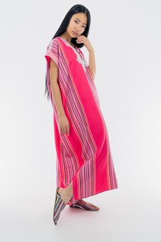 This cotton Kaftan has a particular stripy pattern and a rich white embroidery that makes it so unique in its style. To be worn from your grocery shopping trip, to chilled evenings at home, this kaftan is an essential for the summer! 100% cotton One size  Bust: 28 in Length: 50 in Model is 5'7 in (174 cm) Casual Striped V-neck Kaftan, Striped Kaftan For Spring Vacation, Summer Short Sleeve Cotton Kaftan, Multicolor Cotton Kaftan For Lounging, Multicolor Cotton Kaftan For Loungewear, Multicolor Cotton Kaftan For Spring, Long Multicolor Cotton Kaftan, Multicolor Long Cotton Kaftan, Red Cotton Kaftan For Spring