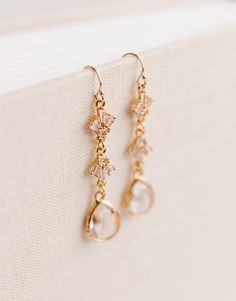 "✨Designed specifically for your special day, but can be worn on any occasion!✨ Beautifully accent any wedding dress or date night outfit with our Rainfall Earrings! Perfectly sparkly with just the right amount of class. These earrings are hypoallergenic and feature a 14k Gold Filled hook with Gold Plated cubic zirconia and vintage glass accents. Earrings measure approx. 1.6\" x .3\" Thank you so much for shopping with GGC! By supporting a small business, you are supporting a dream, a family, and so much more! We are so grateful for you! We hope to create with you again soon! ✨LOOKING FOR MORE EARRINGS?✨ Check out our other listings here: https://www.etsy.com/shop/GoldenGratitudeCol?ref=simple-shop-header-name&listing_id=1157209858§ion_id=37356619" Wedding Earrings Bride Gold, Elegant Drop Bridal Earrings For Wedding Gift, Elegant Wedding Cluster Earrings With Ear Wire, Elegant Linear Drop Earrings For Wedding, Elegant Wedding Drop Linear Earrings, Wedding Dangle Cluster Earrings, Wedding Teardrop Ear Wire Jewelry, Single Teardrop Bridal Earring For Wedding, Delicate Drop Earrings For Wedding