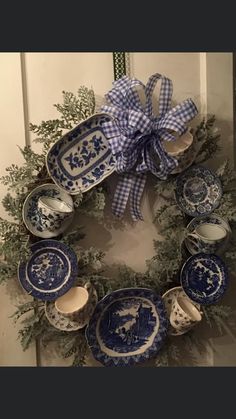 a wreath with blue and white china on it