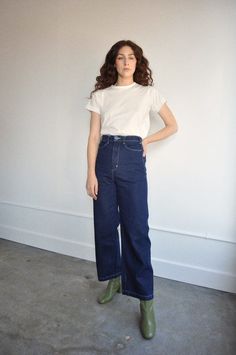 A very high waisted wide legged sturdy pant with a 1930's silhouette.    14 oz washed indigo denim    made in san francisco    brand care instructions:    while this item is pre-washed and we don't anticipate any shrinkage with drying we always encourage you to keep your garments out of extreme heat. drying lessens the lifespan of your garments. and we want you to have this for a long time. Indigo Pre-washed Straight Leg Bottoms, Classic Indigo Wide Leg Bottoms, Retro Wide Leg Jeans For Everyday, Relaxed Fit Wide Leg Bottoms Pre-washed, Retro Wide Leg Bottoms For Everyday Wear, Vintage Wide Leg Rigid Denim Bottoms, Retro Rigid Denim Bottoms For Everyday Wear, Vintage Rigid Denim Bottoms For Everyday, High Rise Vintage Bottoms For Everyday