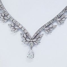 Indulge in the timeless elegance of the Raymond C. Yard Pear Shape Drop Diamond Necklace. This exquisite piece is a testament to the unparalleled craftsmanship and artistry that Raymond C. Yard is renowned for. With a captivating pear-shaped center diamond, certified by GIA, weighing an impressive 1.89 carats, this necklace is a true treasure.Every detail of this necklace is meticulously designed to create a stunning visual impact. The center diamond is delicately suspended, surrounded by a symp Bridal Diamond Necklace, Diamond Drop Necklace, Emerald Cut Diamond Ring, Yellow Jewelry, Antique Jewelry Indian, Pear Cut Diamond, Marquise Cut Diamond, Expensive Jewelry, Platinum Metal