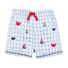 Enjoy The Beach Days With Our Boys Nautical Swim Trunks. The Embroidered Gingham Swim Trunks Feature A Mesh Lining. The Swimsuit Features Upf 50+ Protection. The Suit Features A Blue And White Gingham Pattern With Icons Of Whales, Crabs And Sailboats On It. Poly/Cotton Blend Turn Inside Out Machine Wash Cold With Like Colors No Bleach Tumble Dry Low. Kids Mud, Toddler Swimsuits, Blue And White Gingham, Baby Swimsuit, Boys Swim Trunks, Gingham Pattern, Boys Swim, Innovative Fashion, Mud Pie