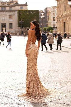 Be the epitome of a golden goddess in the Agata Sequin Gown. Made from our signature sparkling gold sequins fabric, you'll look incredible from every angle in this show-stopping gown. Also features a plunge neckline & lace up back with a mermaid train. What is a Made-To-Order? This product is a made-to-order item. Made-to-order items are not held in physical stock and production commences AFTER order placement. We try to limit production and stock levels and as such, made-to-order items produce Gold Formal Dress Long, Runway Poses, Gold Formal Dresses, Formal Poses, Prom Aesthetic, Balyage Hair, Formal Photos, Gold Sequin Gown, Gold Sequin Fabric