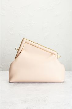 Find FENDI Fast Shoulder Bag on Editorialist. Fendi Fast Shoulder Bag in Pink Pink lambskin leather with gold-tone hardware Canvas interior. Made in Italy. Pushlock closure. One Main Compartment. Removeable shoulder strap. Includes original dust bag, 2 material cards, and 2 authenticity cards. Measures approx 12 W x 9 H x 4 D Shoulder strap with an 11 drop. Like New. No significant flaws or wear. Does not include brand box. FNEF-WY2876. 7586800. About the designer: Pink Fendi, Fendi First, Fendi Pink, Pink Clutch, Lambskin Leather, Pink Bag, Evening Bags, Leather Shoulder Bag, Bags Designer