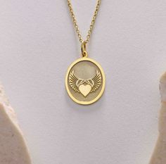 Gold Angel wing heart Pendant - Angel wing heart Gold Necklace ● Material of pendant: Solid Gold 14k ( REAL GOLD ) ● Metal Stamp: 14k ( REAL GOLD ) ● The pendant is available in 5sizes: - 12x17 mm / 0,47 x 0,66 inches - 13x18 mm / 0,51 x 0,70 inches  In the photos - 14x19 mm / 0,55 x 0,74 inches  - 16x21 mm / 0,62 x 0,82 inches  - 18x24 mm / 0,70 x 0,94 inches ( In the photos the size is 13x18 mm / 0,51 x 0,70 inches ) ( Jump Ring inner diameter: 4 mm ) ● Material of chain: Solid gold 14k ( REAL GOLD ) It is thin and dainty and it is available in 4 sizes: - 40 cm / 15,75 inches ( Length ) - 45 cm / 17,72 inches ( Length ) In the photos - 50 cm / 19,68 inches ( Length ) - 55 cm / 21,65 inches ( Length ) ● Backside engraving is FREE ( Please use the personalization box for that.) ● If you wa Birthday Pendant Necklace With Charms, Anniversary Pendant Charm Necklaces, Oval Charms Necklace For Gift, Oval Charm Necklaces As Gift, Gold Sterling Silver Heart Necklace For Birthday, Oval Charm Necklaces For Gifts, Gold Locket Necklace For Birthday, Gold Engraved Heart Necklace For Birthday, Medallion Necklaces For Valentine's Day Gift